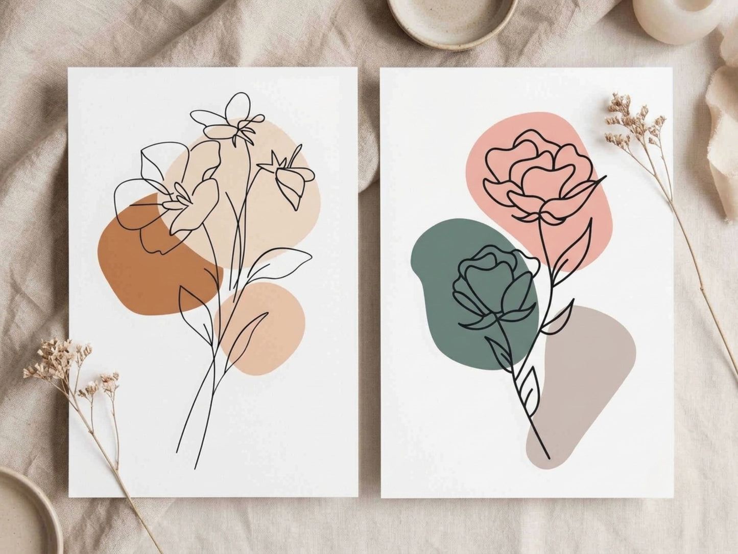 Botanical line-art print set of 2 with charcoal florals in terracotta, sage and blush shown unframed in a flat-lay detail by VYLOIRE