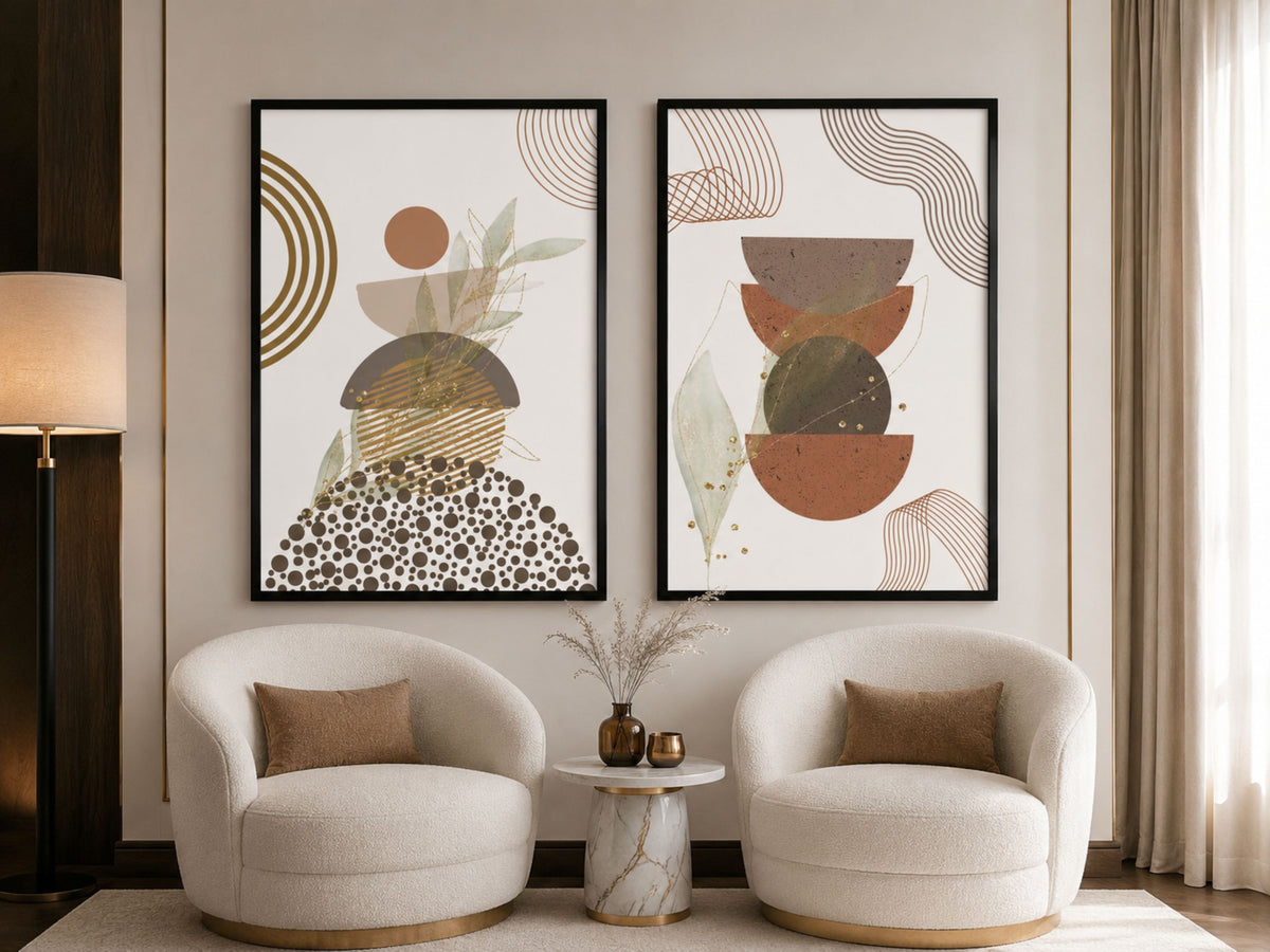 Terracotta, sage and gold abstract botanical art set of 2 in black frames above bouclé armchairs and a marble side table by VYLOIRE.