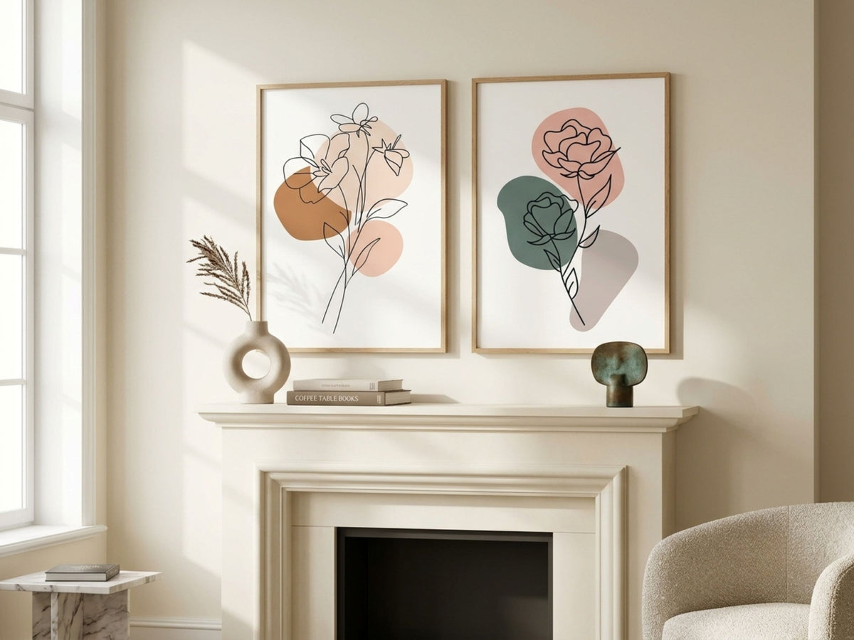 Luxury botanical line-art set of 2 in terracotta and sage, oak frames, above a fireplace mantel in a sunlit living room by VYLOIRE
