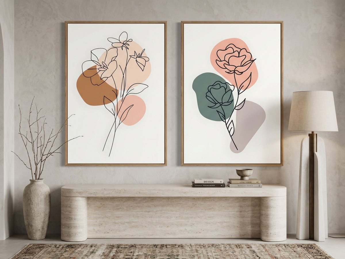 Minimalist botanical line-art set of 2 in terracotta and sage, oak frames, above a travertine console in a luxury entryway by VYLOIRE
