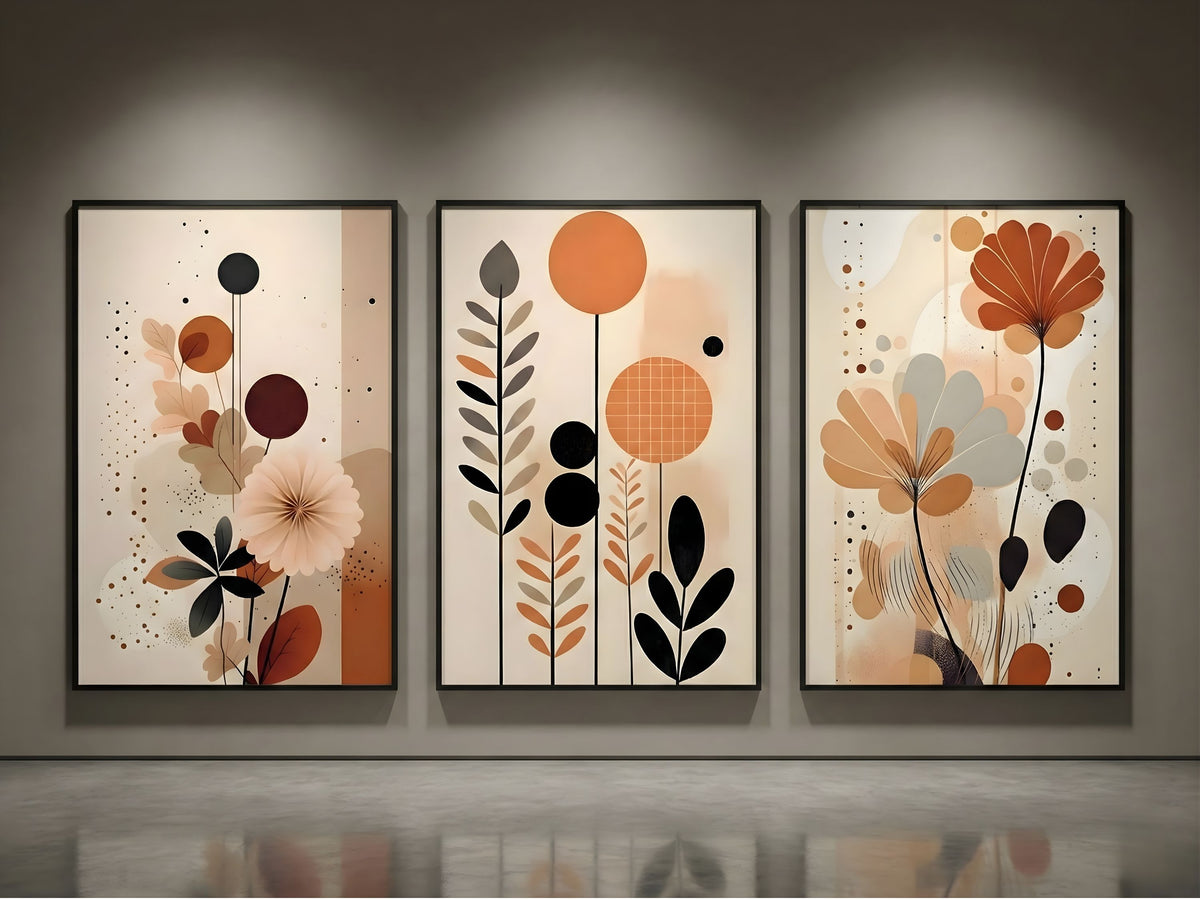 Premium abstract botanical triptych set of 3 in terracotta and charcoal, black frames, spotlit on a modern gallery wall by VYLOIRE