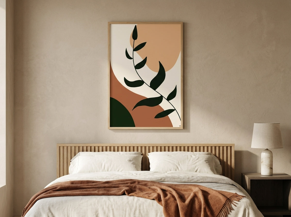 Single boho botanical leaf-branch art print in terracotta and olive green, oak frame, above a wooden bedroom headboard by VYLOIRE