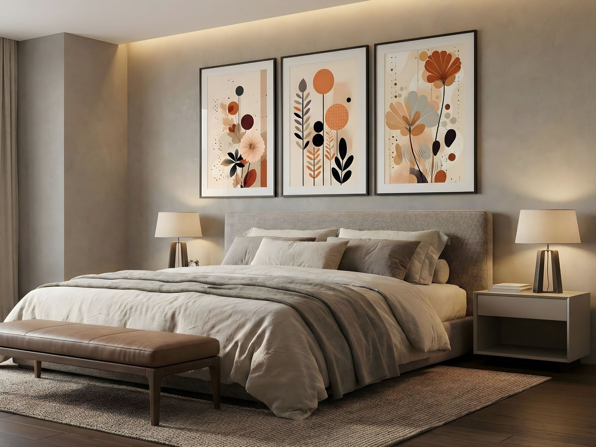 Terracotta and charcoal abstract botanical set of 3 in black frames above a bed in a neutral modern bedroom by VYLOIRE